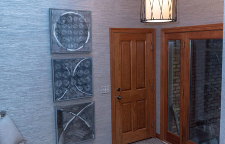 House entrance with grey accents and wooden door