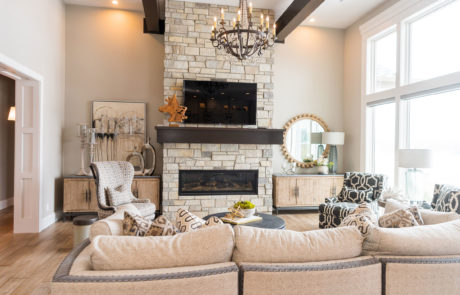 Open living room space with neutral accented couches and chairs