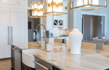 White & grey marble countertop island & abstract chandeliers