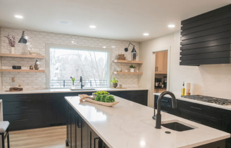 White marble top and black cabinets in kitchen